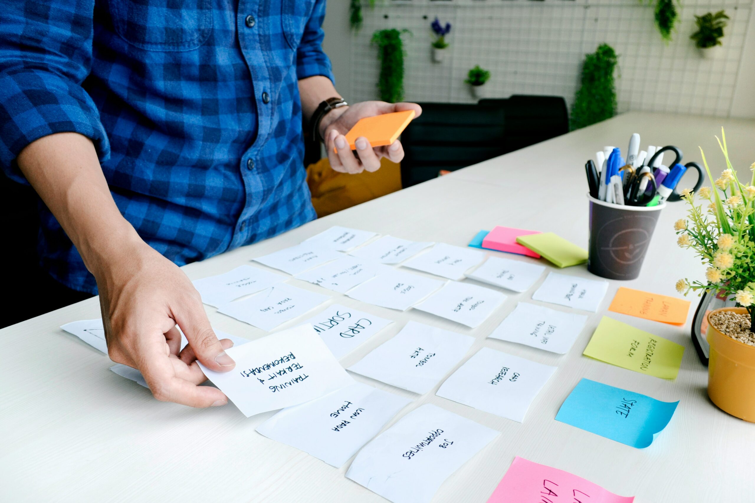 Team sorting sticky notes and cards during a planning workshop